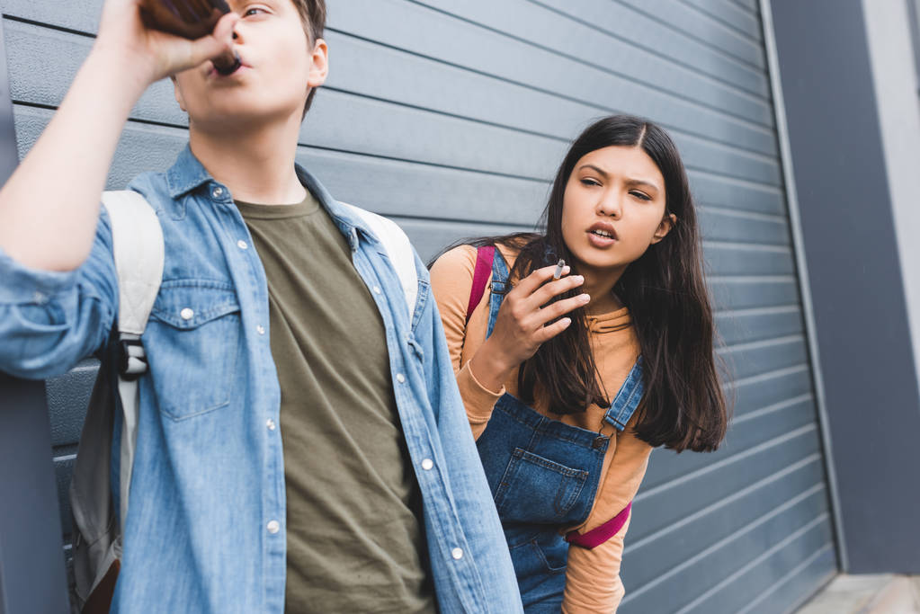 smoking cigarette and drinking beer