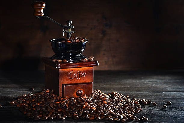 Vintage manual coffee grinder with coffee beans Manual Coffee Grinder