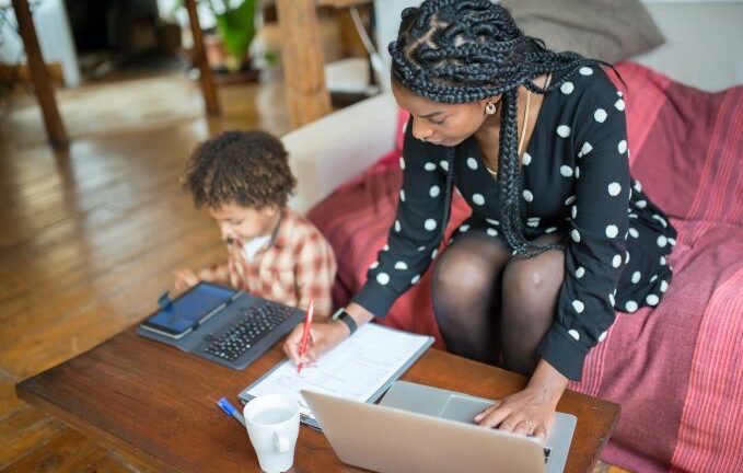 Mother and Child Sitting at the Table