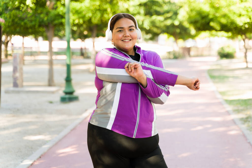 stretching her arms 