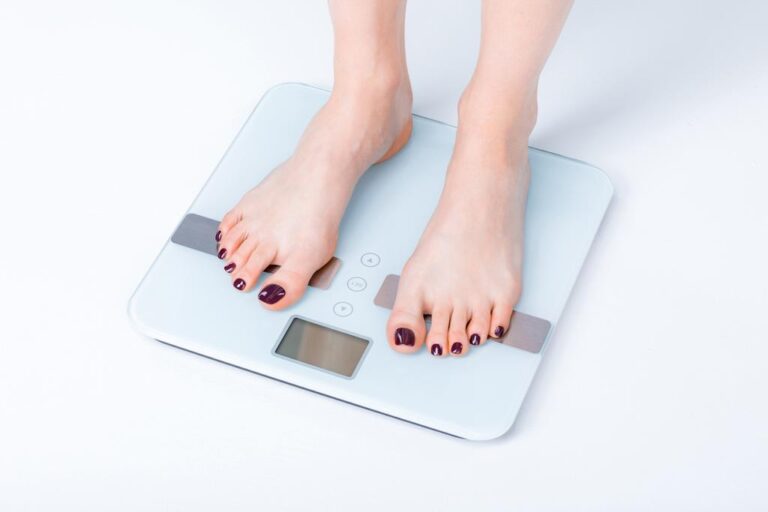 woman standing on digital scales