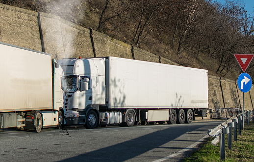 Frontal collision between two goods trucks.