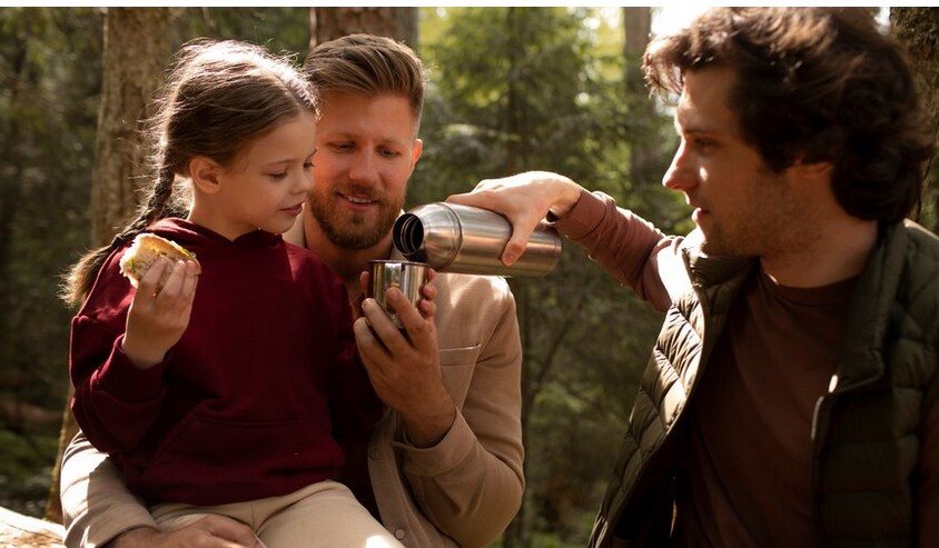 girl with her dads enjoying family trip