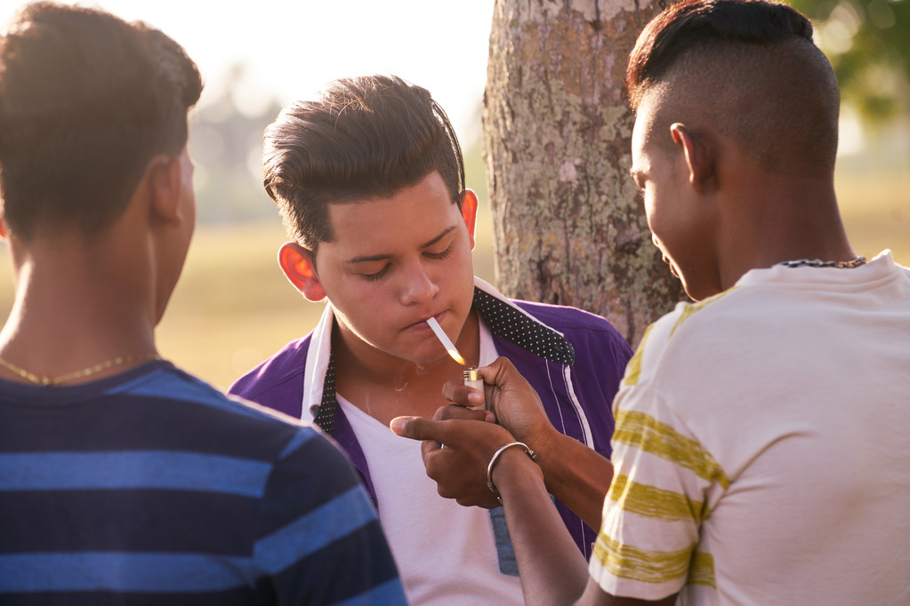 Hispanic kid smoking cigarette