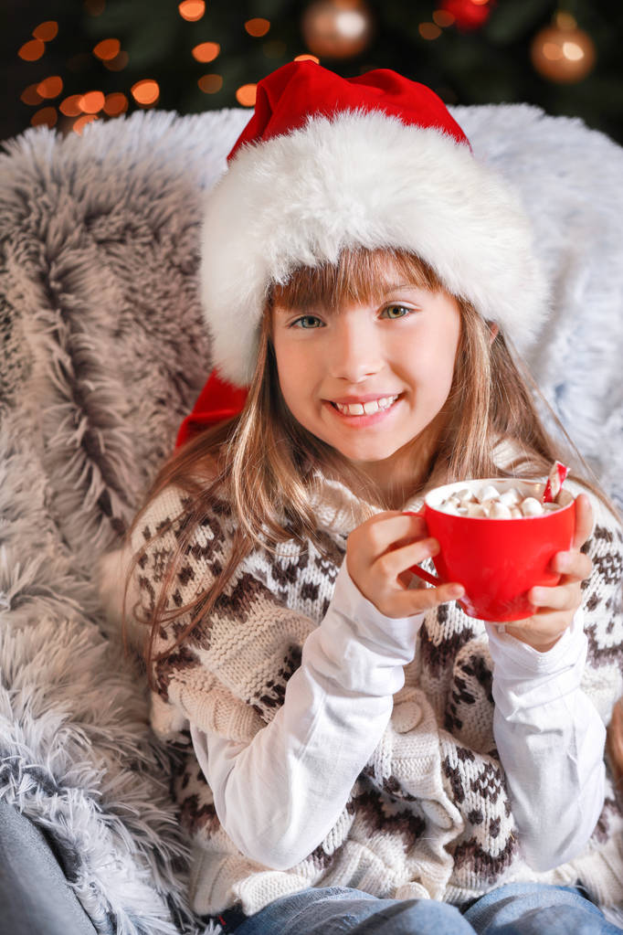 Little girl drinking hot chocolate