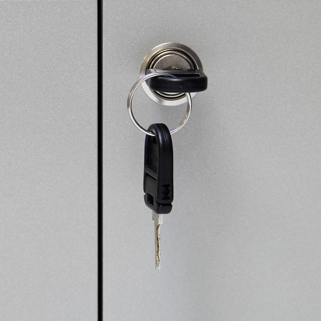 A key in keyhole with locking a cabinet 