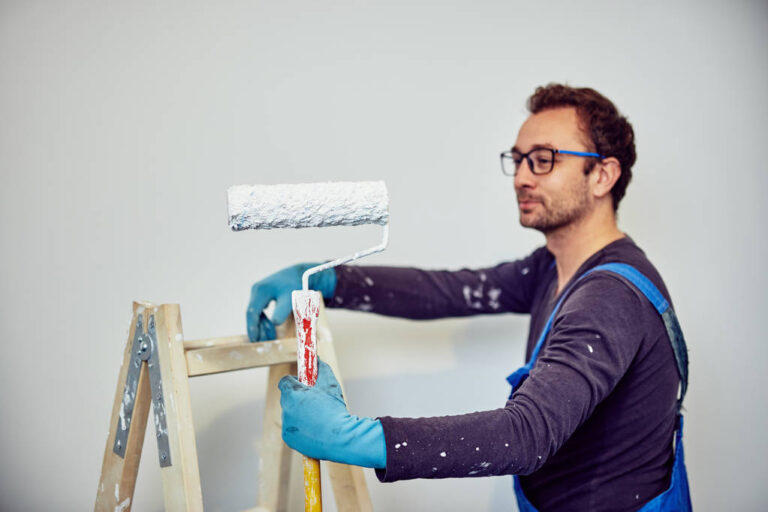 Worker painting walls