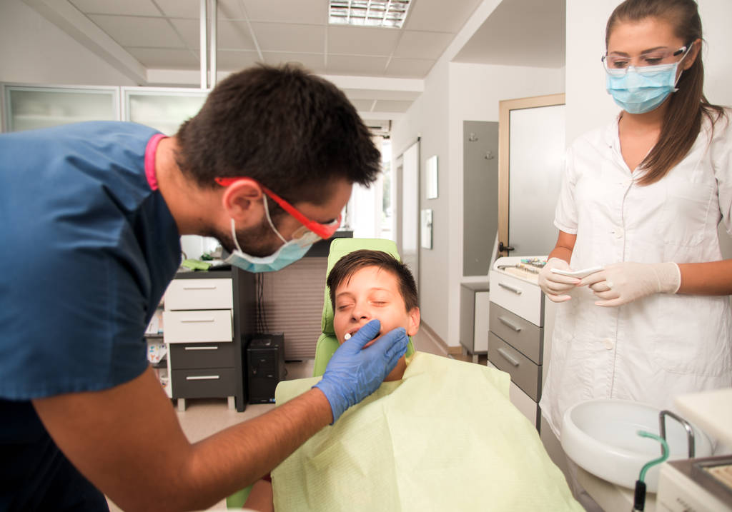 Boy with perfect teeth at the dentist