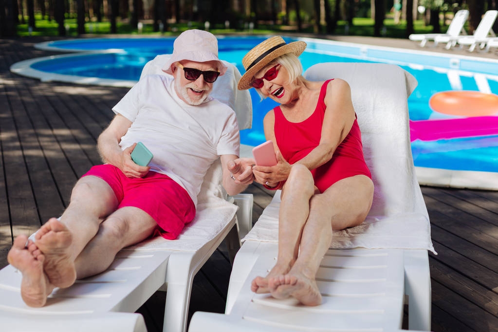 Grandparents sunbathing