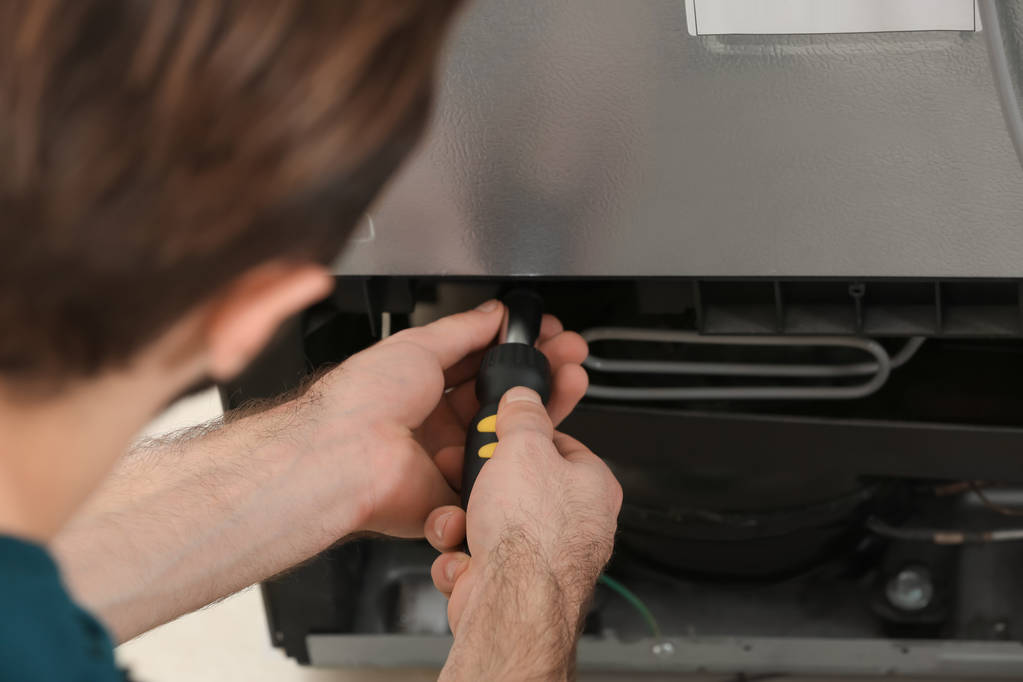 repairing refrigerator