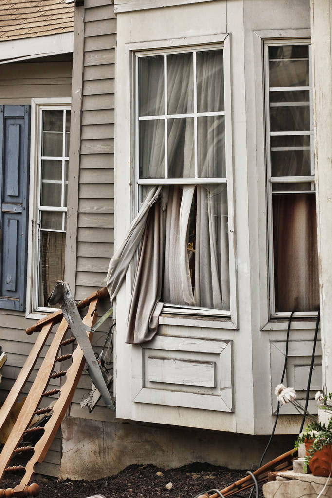 Wooden house damaged by disaster