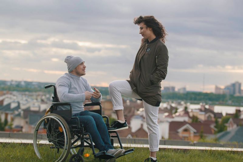 woman with young disabled man
