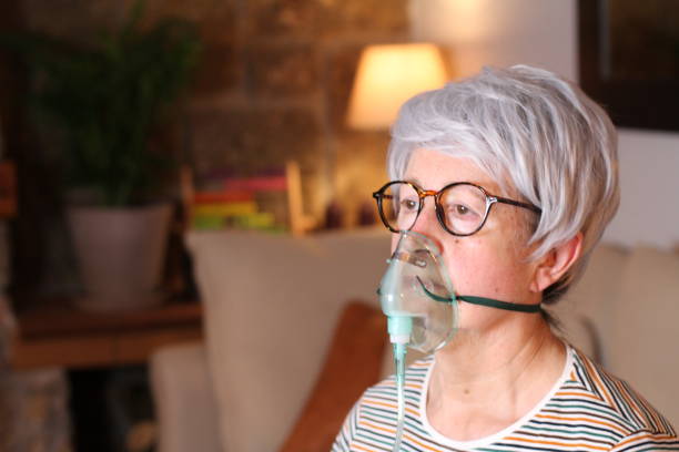 Senior woman receiving oxygen therapy. Essential Tips for At-Home Medical Device Care This Winter
