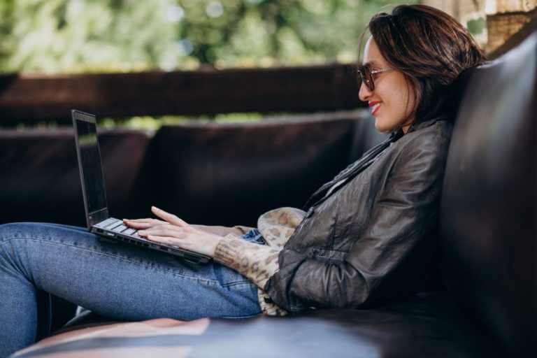 business woman working laptop out home