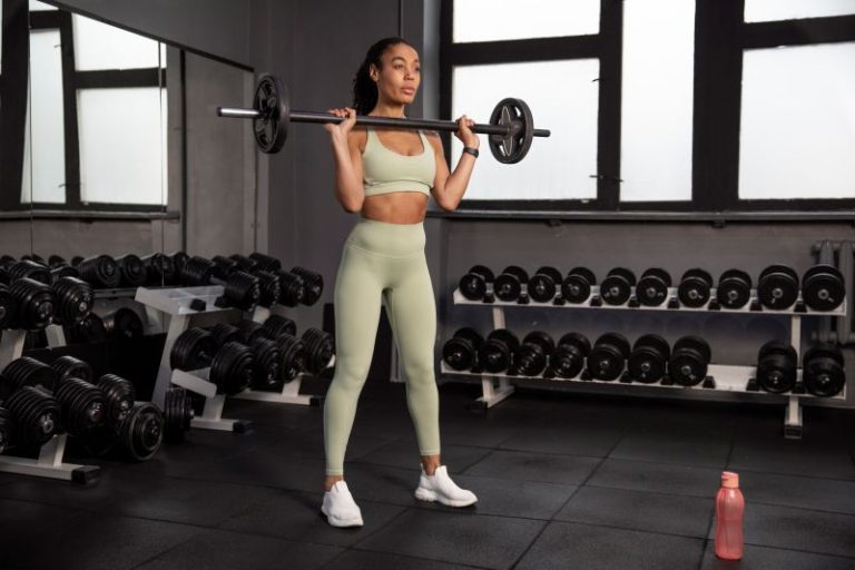 woman training weightlifting gym