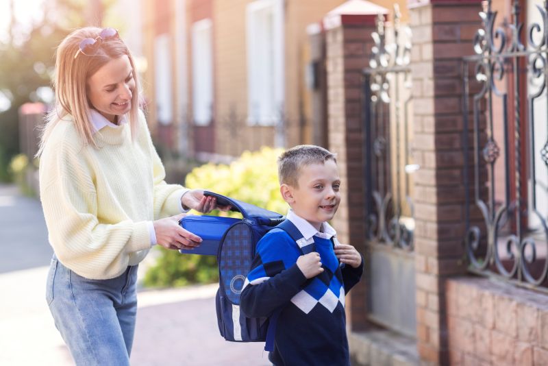 kid first day school side view back to school