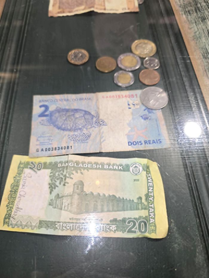 money money displayed underneath the glass