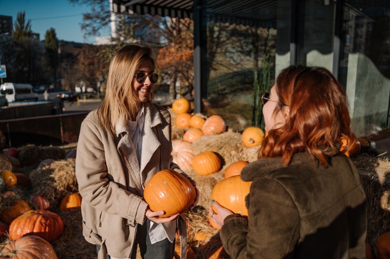 girls holds pumpkins hands How to Keep Early-Purchased Pumpkins Fresh Until Halloween