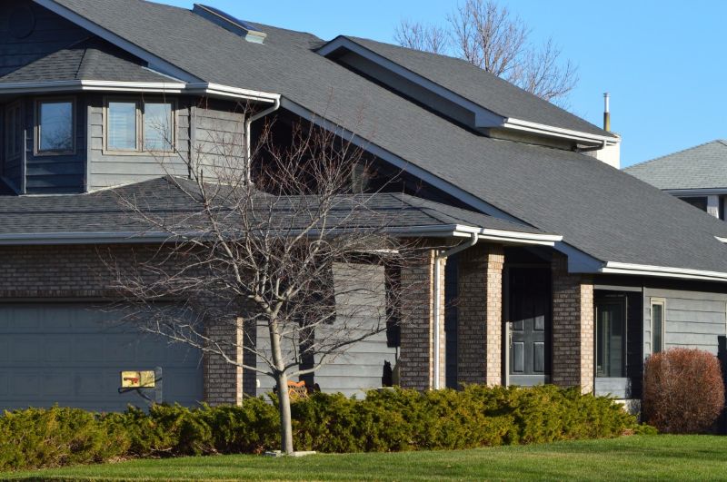 house home neighborhood Metal Roof vs. Asphalt Shingles: Which Is Right for Your Home?